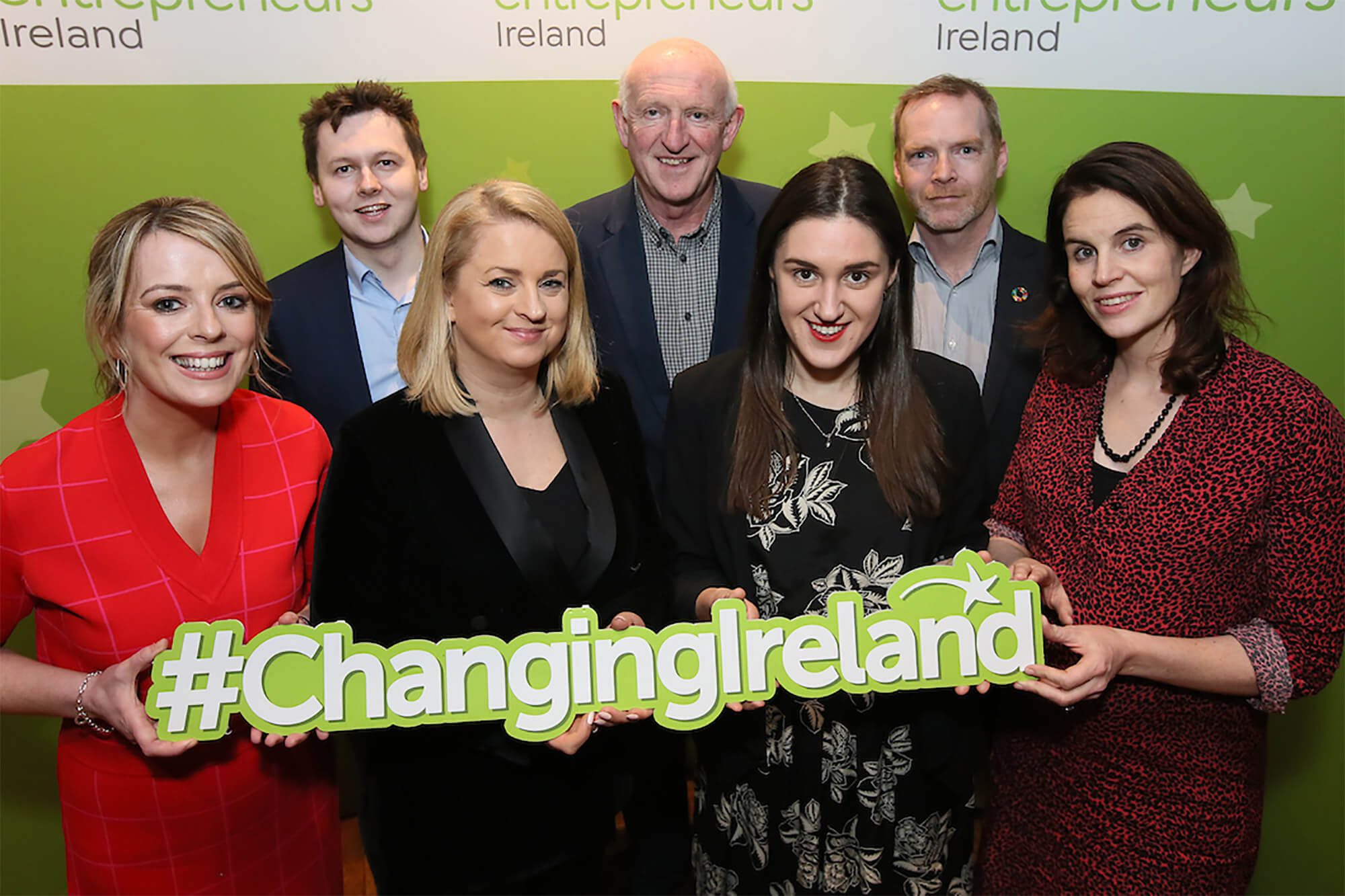 People holding sign saying changing ireland