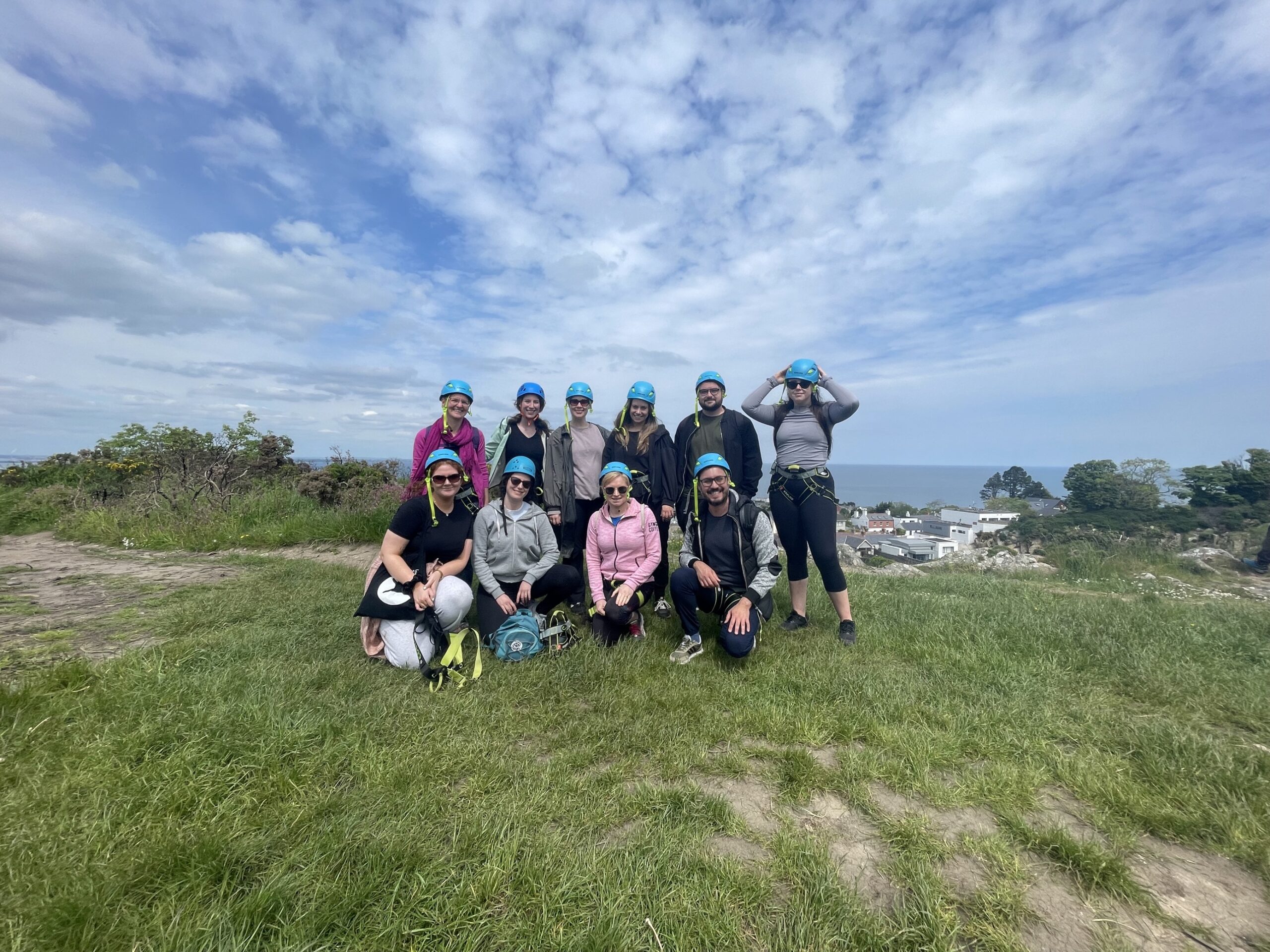 The SEI Team posing in their rock-climbing gear at the top of Killiney Hill.